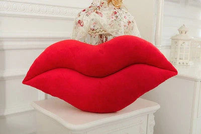 Adorable lip-shaped plush pillow for children in pink and red, perfect for cuddles and decor