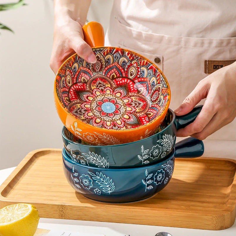 Set of elegant ceramic dessert bowls featuring hand-painted floral patterns in blue, red, and green glazes
