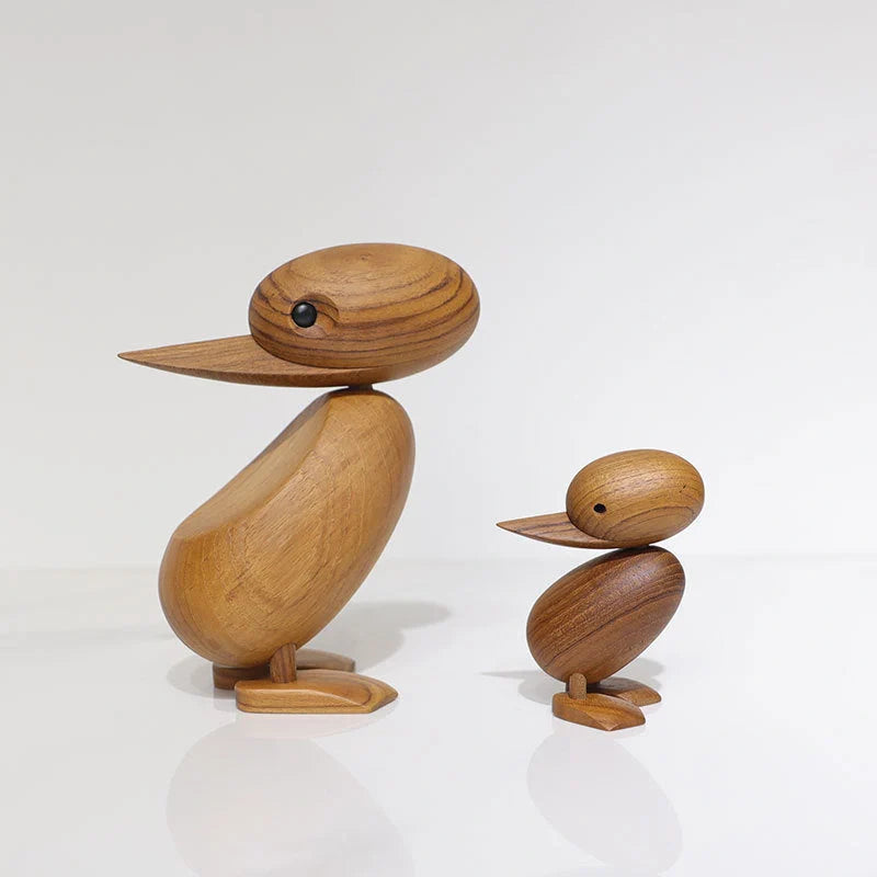 Handcrafted teak wood duck toy in duck yellow, available in large and small sizes