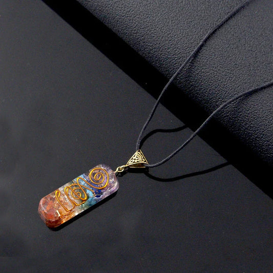 A stunning chakra crystal pendant with natural patterns and organic imperfections, showcasing the beauty of nature.