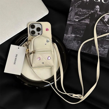 Crossbody wallet phone case for ApplePhone in white, black, or pink with removable shoulder strap