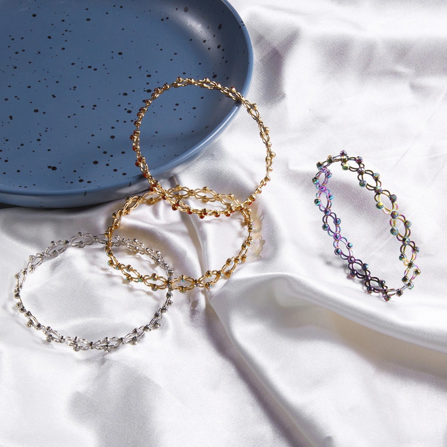 2-in-1 folding retractable rings bracelet with rhinestone detail, adjustable design