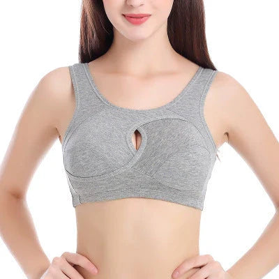 Supportive cotton sports bra with crossover design for lift and support, preventing sagging and bra lines
