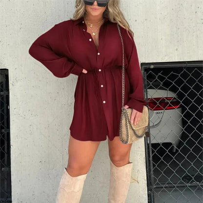 Women's long sleeve jumpsuit with button accents in various vibrant colors