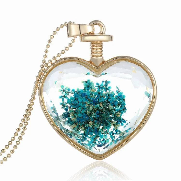 Elegant glass-encased dried flower pendant necklace with bead chain, showcasing a variety of preserved floral arrangements.