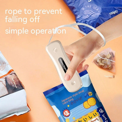 Compact USB mini sealing machine for kitchen food preservation in black and milky white