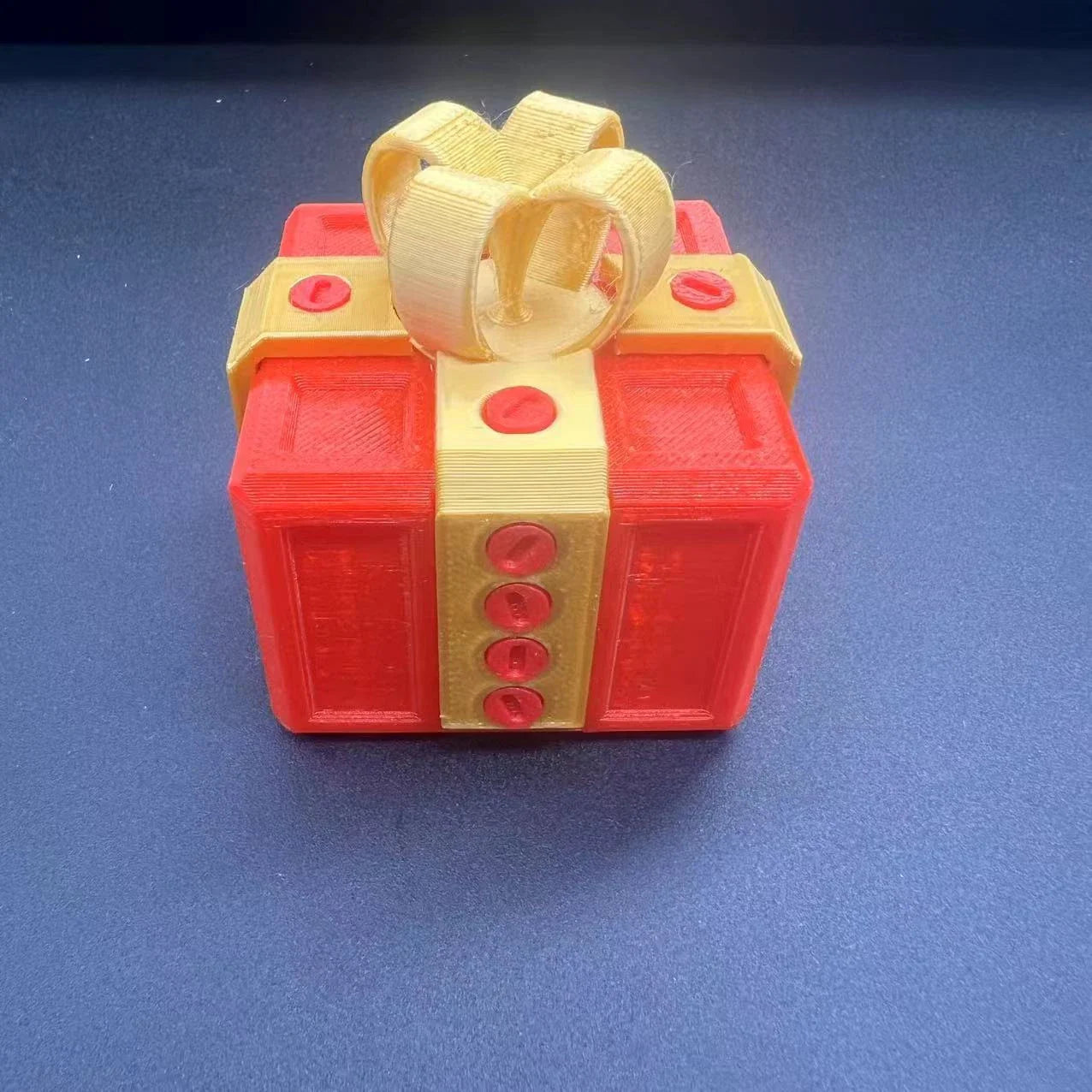 Clever Gag Gift Box - Unique 3D printed design in various colors with a humorous "trouble" concept for prank gifts and creative holiday presents