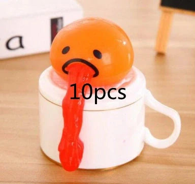 Gudetama Vomiting Egg Toy in green, orange, pink, and yellow
