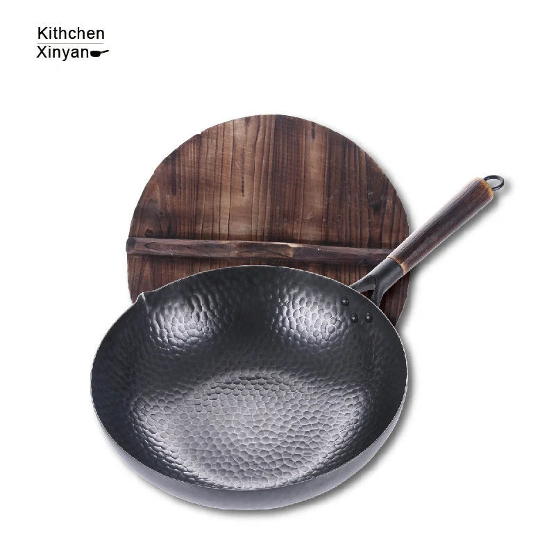 Traditional handmade iron wok with wooden handle and lid