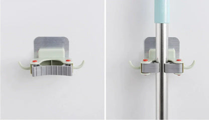 Adhesive wall-mounted mop and broom holder with double hooks for storing cleaning tools, available in multiple colors.