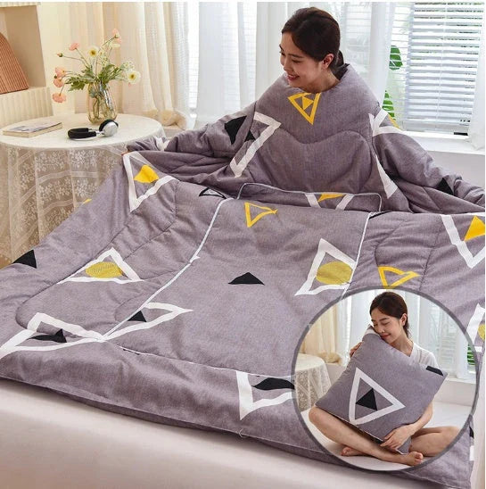Cozy quilted lounger with sleeves in various colors and sizes, perfect for year-round indoor comfort and relaxation.