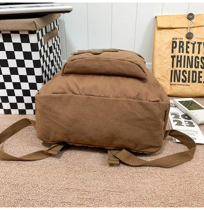A stylish and durable canvas backpack with geometric patterns, designed for female college students
