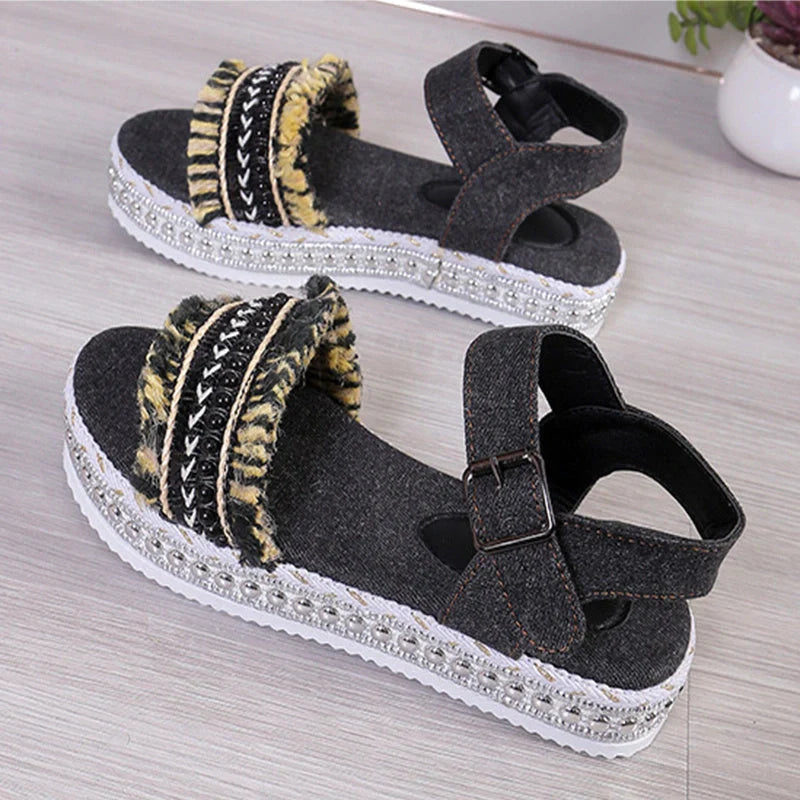 Stylish denim tassel sandals for women with thick flat sole, perfect for summer.