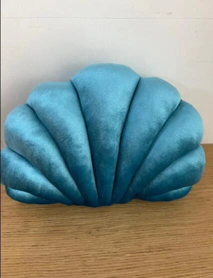 Cosy shell-shaped plush nap pillow in various colours and sizes for ultimate comfort