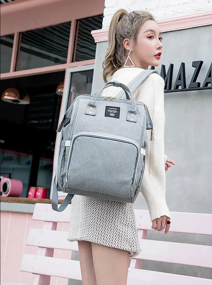 Premium mummy backpack in a range of stylish colours, featuring dedicated compartments for bottles, nappies and personal items.
