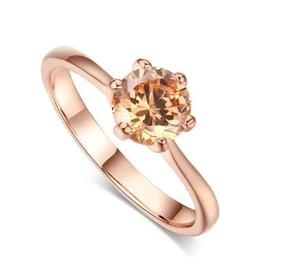 Elegant rose gold and zircon ring with a geometric design and sparkling zircon stones