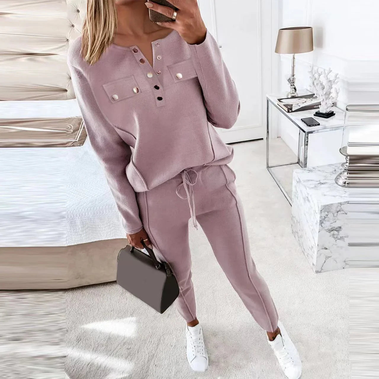 Cozy two-piece lounge set in soft cotton-blend fabric with crew-neck sweatshirt top and high-waisted drawstring pants