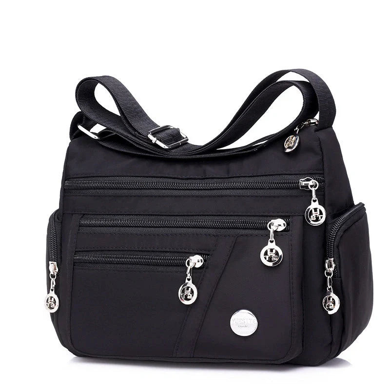 Ladies waterproof nylon oxford crossbody bag in various colors with multi-layer storage
