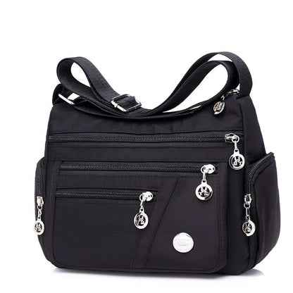 Ladies waterproof nylon oxford crossbody bag in various colors with multi-layer storage