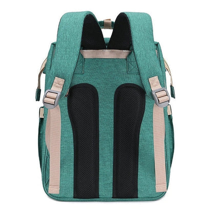 Portable folding crib and mummy bag in green and grey, compact design for baby travel