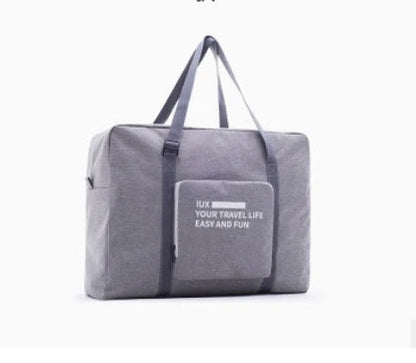 Foldable nylon travel holdall in various colours, including black, orange, green, and red