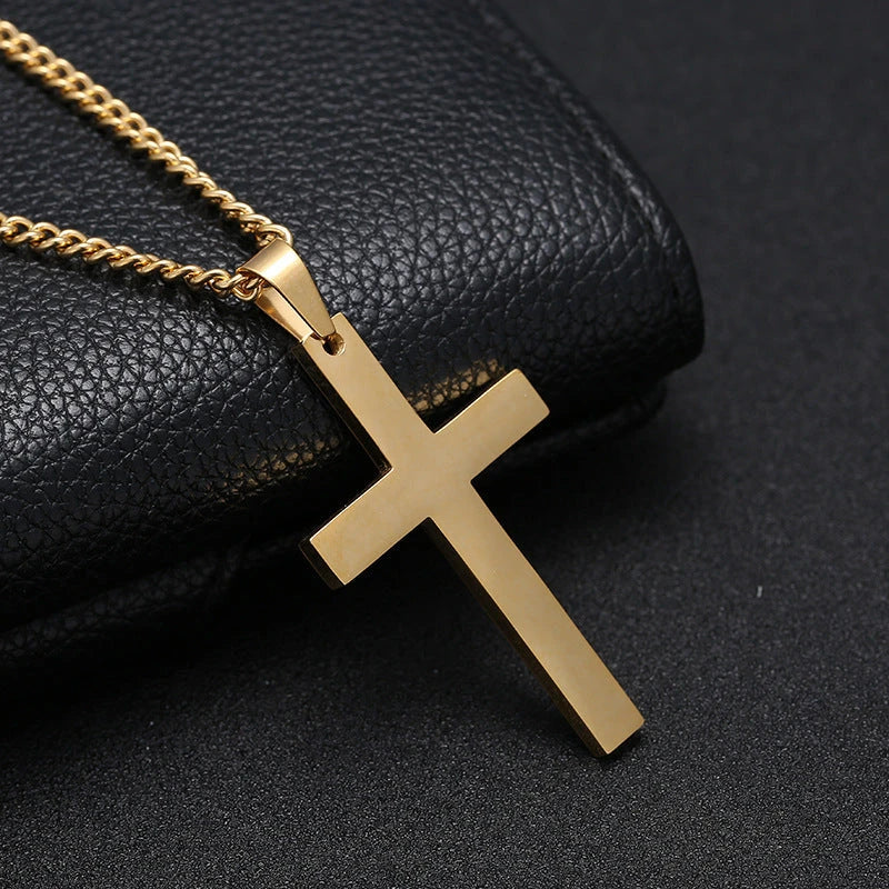 Stainless steel cross pendant necklace in black, silver, and gold colours, showcasing a classic and elegant design