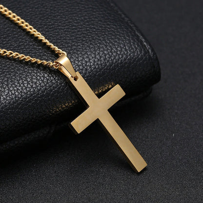 Stainless steel cross pendant necklace in black, silver, and gold colours, showcasing a classic and elegant design