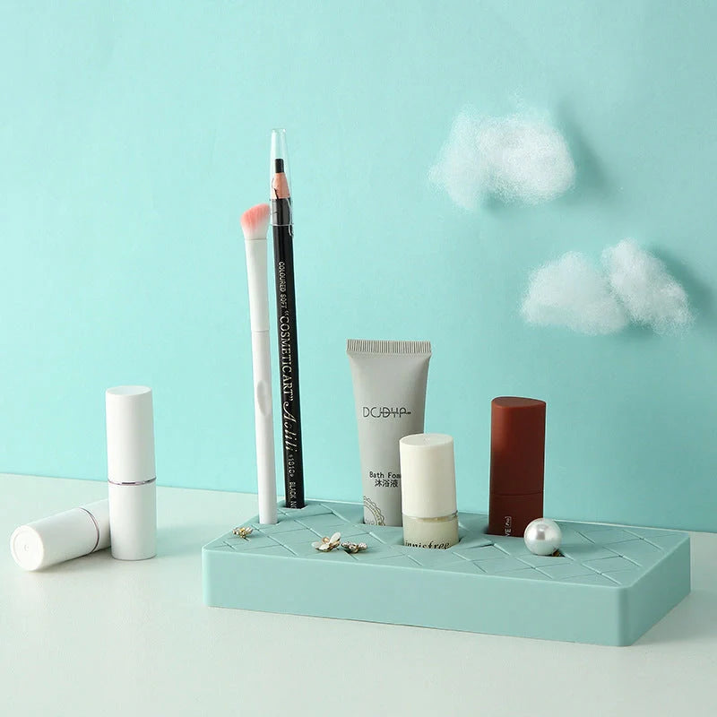 Silicone and ABS lipstick storage rack in red, pink, blue, and grey