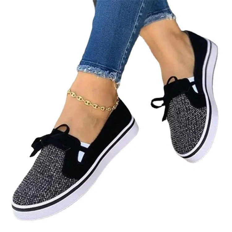 Women's white lace-up canvas flat shoes with cross straps