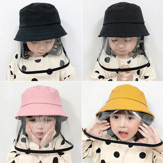 Child wearing anti-spitting protective hat with transparent bezel