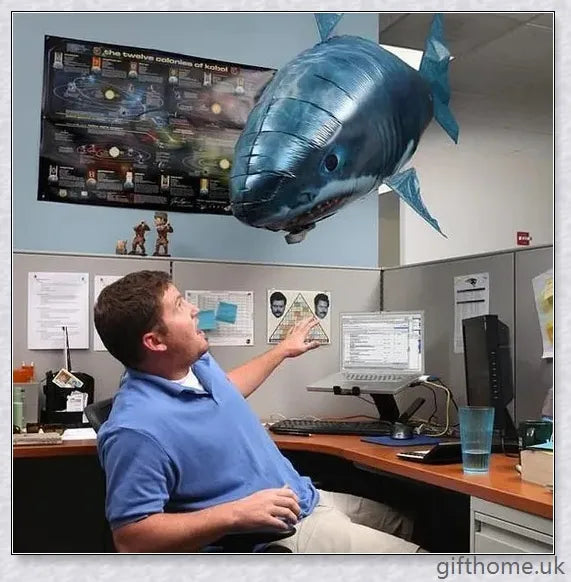The Amazing Air Shark - Updated Version soaring through the air with its smooth, life-like motion. A durable, helium-powered flying shark perfect for indoor parties and events.