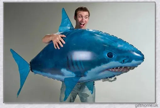 The Amazing Air Shark - Updated Version soaring through the air with its smooth, life-like motion. A durable, helium-powered flying shark perfect for indoor parties and events.