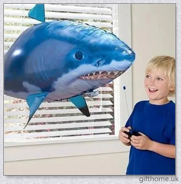 The Amazing Air Shark - Updated Version soaring through the air with its smooth, life-like motion. A durable, helium-powered flying shark perfect for indoor parties and events.
