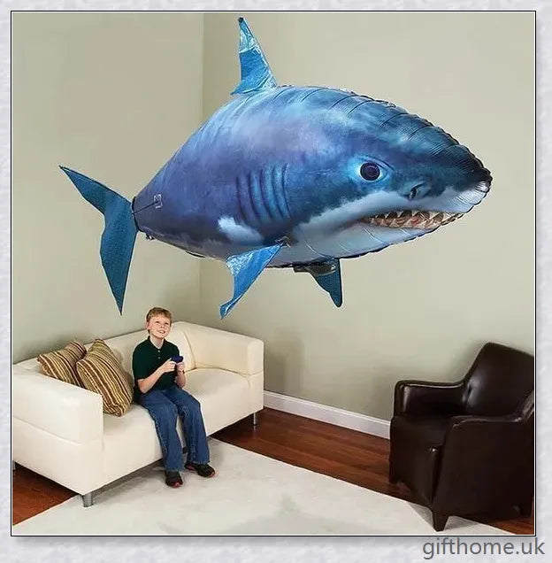 The Amazing Air Shark - Updated Version soaring through the air with its smooth, life-like motion. A durable, helium-powered flying shark perfect for indoor parties and events.