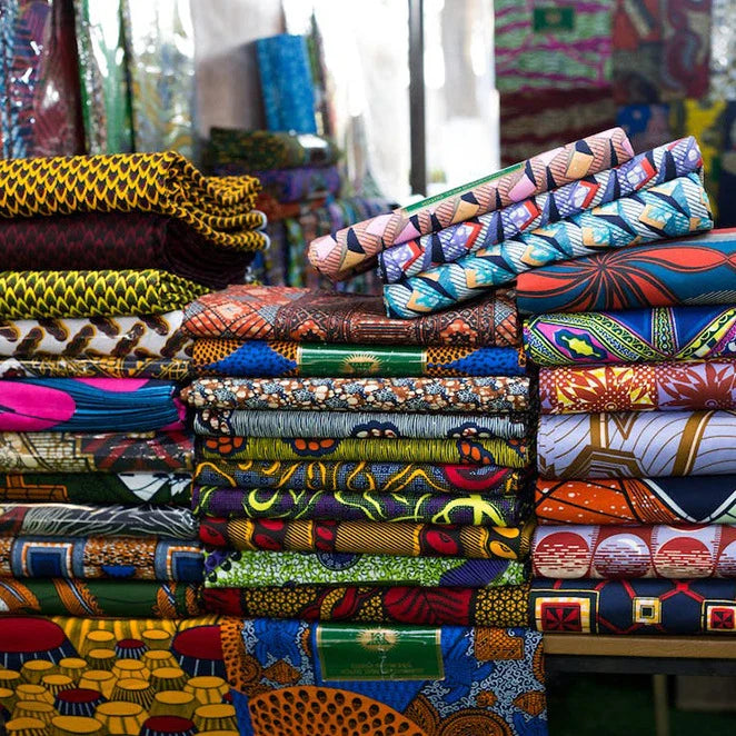 A vibrant, botanical-patterned African wax fabric inspired by Dutch design, suitable for a variety of sewing and crafting projects.
