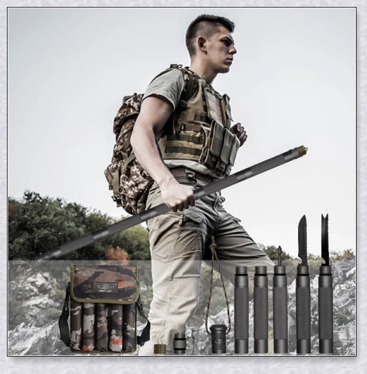 Multipurpose tactical trekking pole with adjustable length, grey colour, and various attachments like compass, whistle, and screwdriver