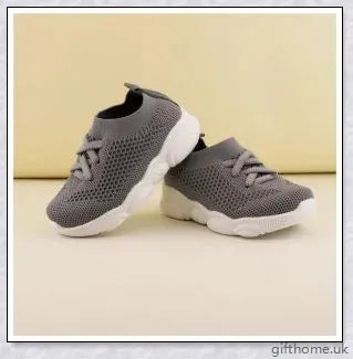 Soft-soled toddler shoes for boys and girls featuring a grid pattern design and non-slip sole for comfort and safety
