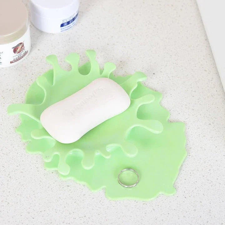 Eco-friendly blood-shaped plastic rest for kitchen tools, designed to hold various cooking utensils and add a touch of quirky charm to your cooking space
