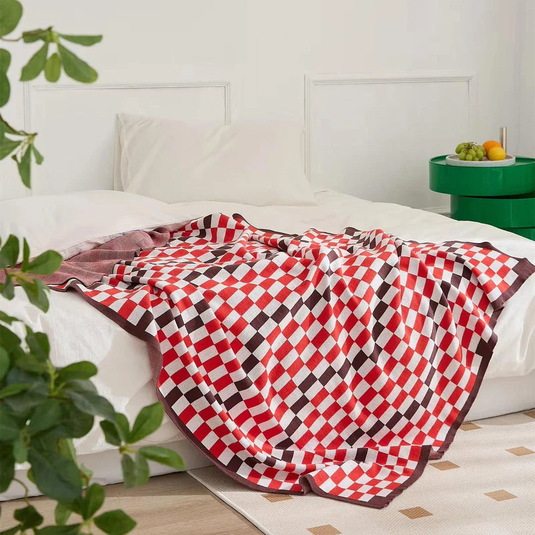 Cosy plaid blanket in a vibrant blue colour, perfect for adding warmth and charm to any indoor or outdoor setting.