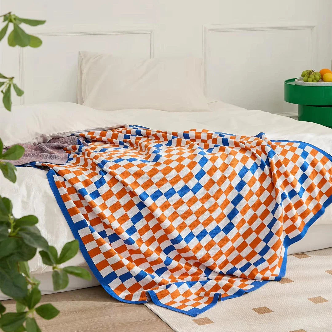 Cosy plaid blanket in a vibrant blue colour, perfect for adding warmth and charm to any indoor or outdoor setting.