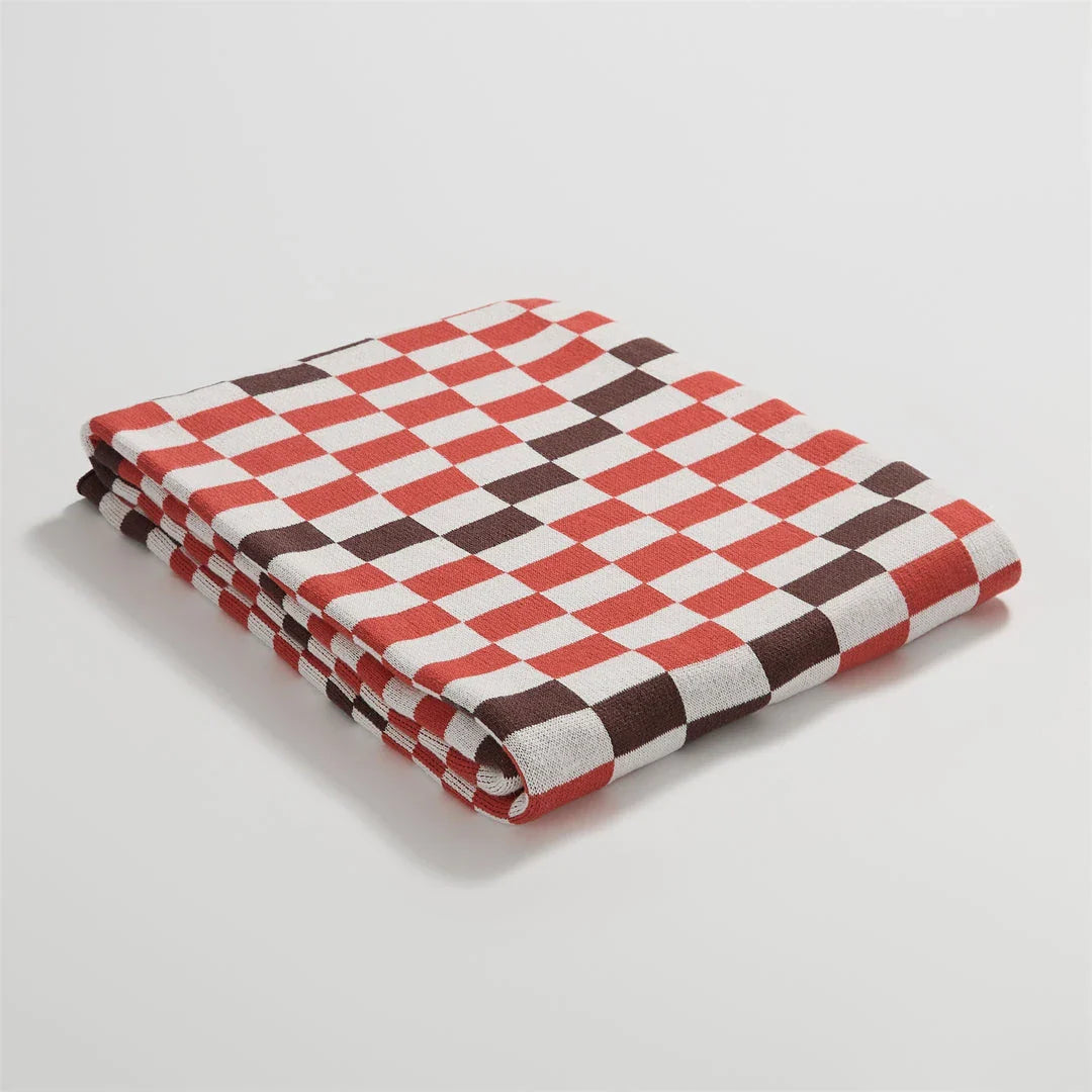 Cosy plaid blanket in a vibrant blue colour, perfect for adding warmth and charm to any indoor or outdoor setting.