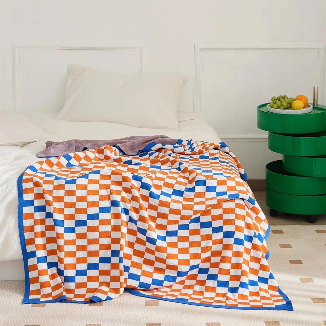 Cosy plaid blanket in a vibrant blue colour, perfect for adding warmth and charm to any indoor or outdoor setting.