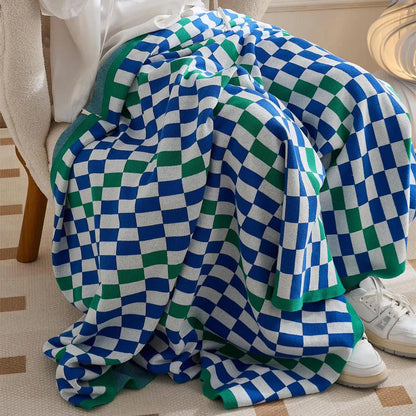 Cosy plaid blanket in a vibrant blue colour, perfect for adding warmth and charm to any indoor or outdoor setting.