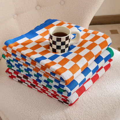 Cosy plaid blanket in a vibrant blue colour, perfect for adding warmth and charm to any indoor or outdoor setting.