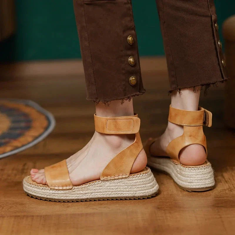Chic leather platform sandals in yellow with a secure buckle strap and open side vamp design