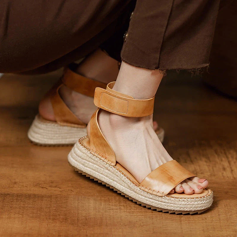 Chic leather platform sandals in yellow with a secure buckle strap and open side vamp design