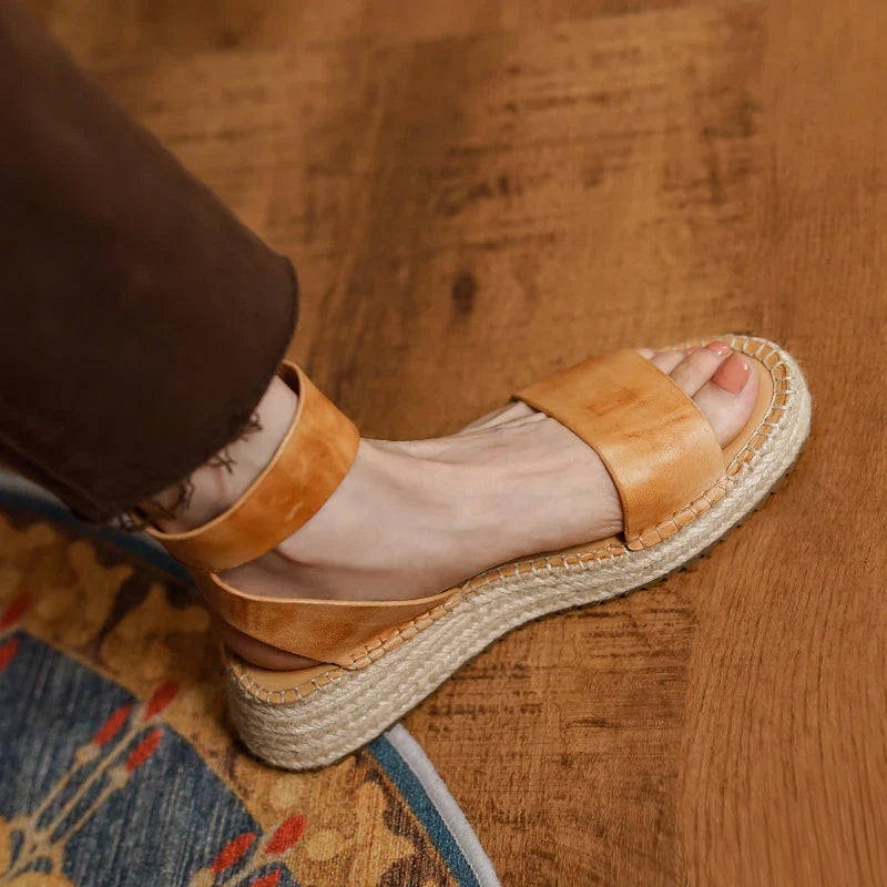 Chic leather platform sandals in yellow with a secure buckle strap and open side vamp design