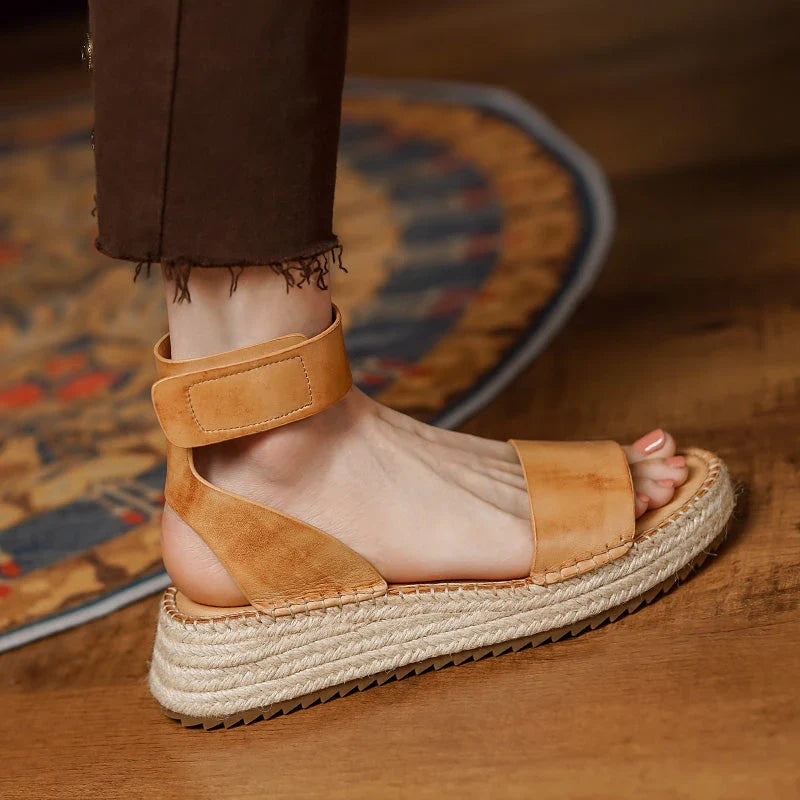 Chic leather platform sandals in yellow with a secure buckle strap and open side vamp design