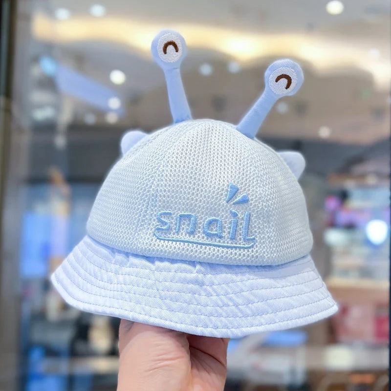 A blue cotton baby bucket hat with a solid colour design to protect your child from harmful UV rays.