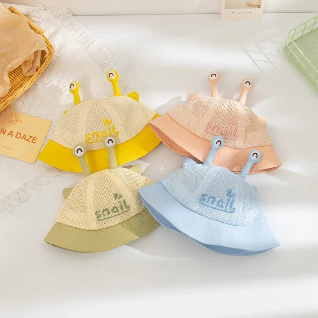 A blue cotton baby bucket hat with a solid colour design to protect your child from harmful UV rays.